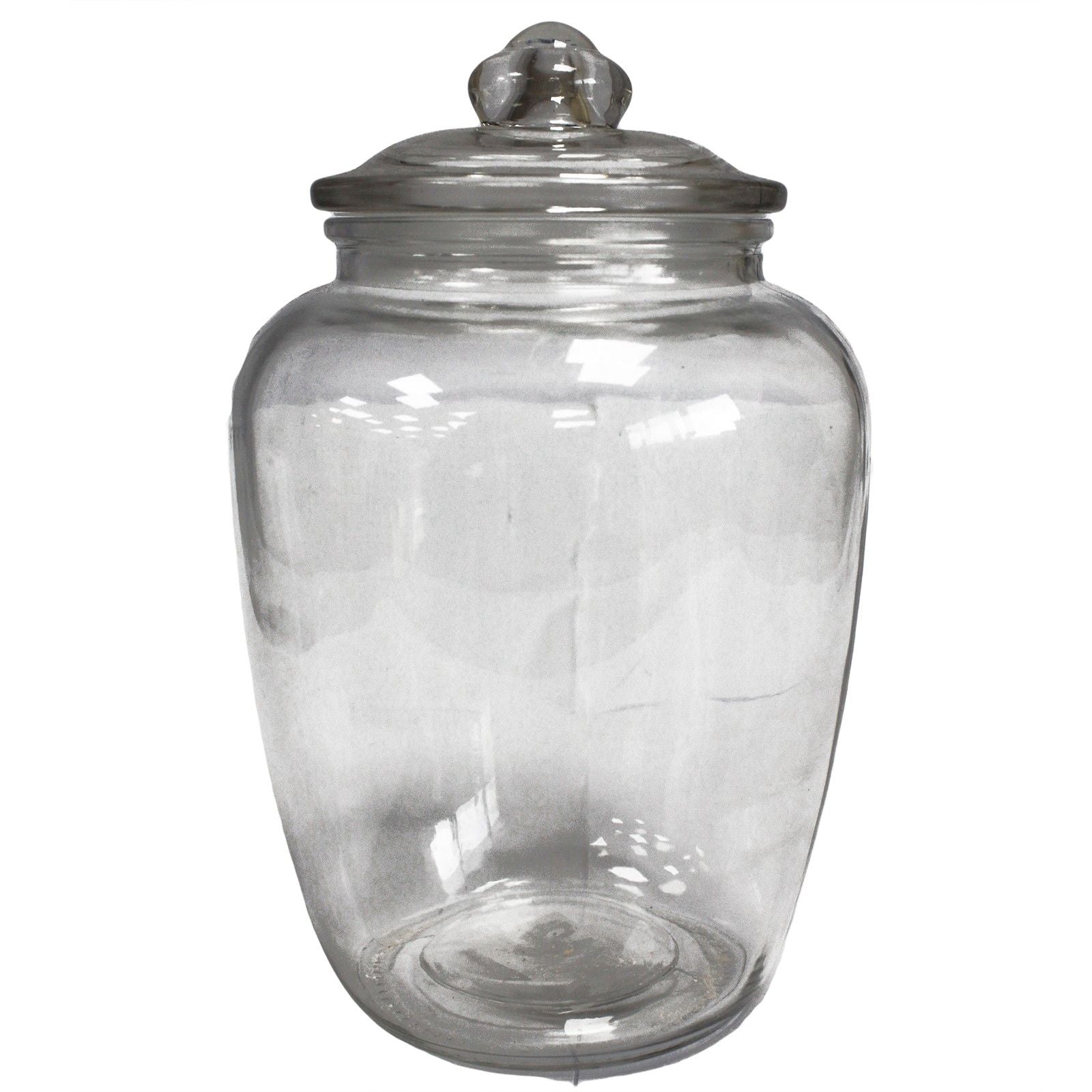 Large classic clear glass candy jar with a rounded body and matching glass lid in a simple elegant design.