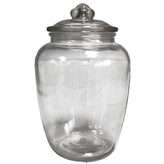 Large classic clear glass candy jar with a rounded body and matching glass lid in a simple elegant design.