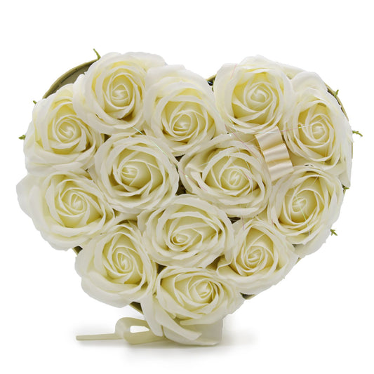 Elegant heart-shaped gift box filled with thirteen realistic cream-coloured soap roses arranged in a decorative bouquet.
