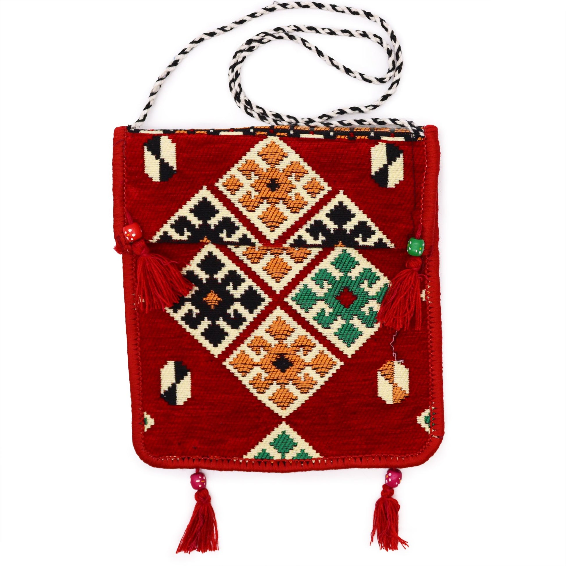 Handcrafted red Kilim messenger bag featuring intricate traditional woven patterns and a versatile festival-style design.