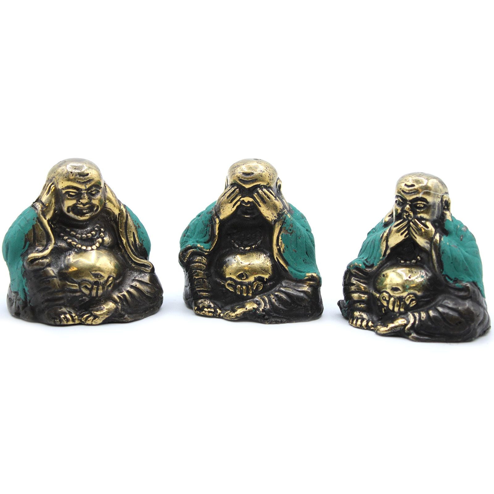 Three small brass Buddha statues in 'see no evil, hear no evil, speak no evil' poses on a plain background.