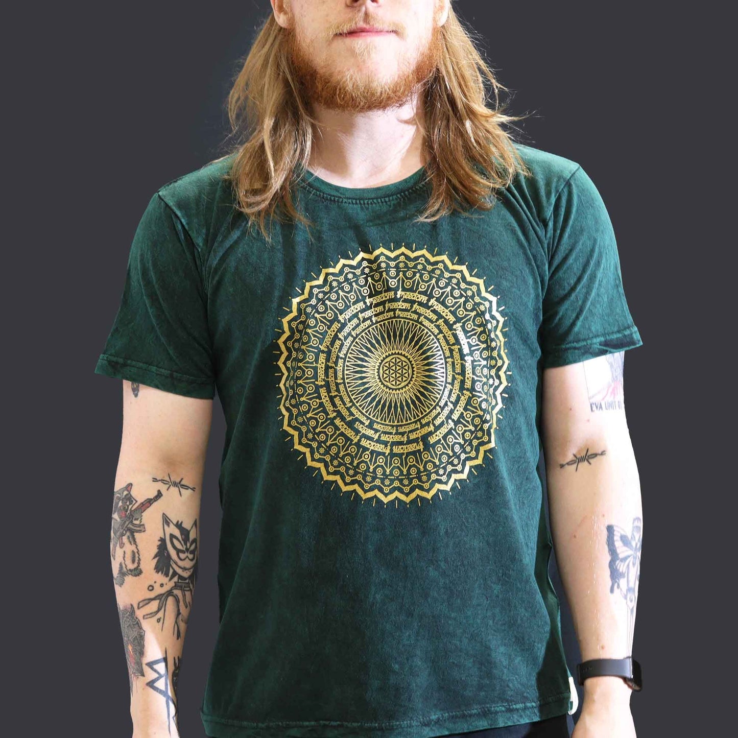 Large green stone washed t-shirt featuring a detailed white mandala design on the front.