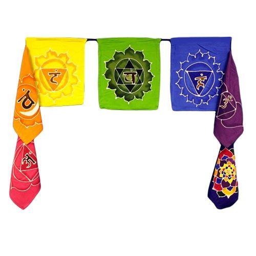 Set of seven colourful vertical batik flags representing the chakras with intricate wax-resist designs on fabric.
