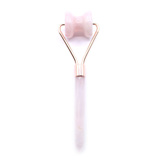 Rose quartz gemstone facial roller designed for jawline massage with a smooth pink stone and ergonomic handle.