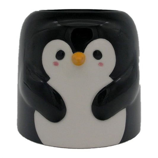 Cute black and white penguin shaped ceramic oil burner with a tealight opening at the back and bowl on top.