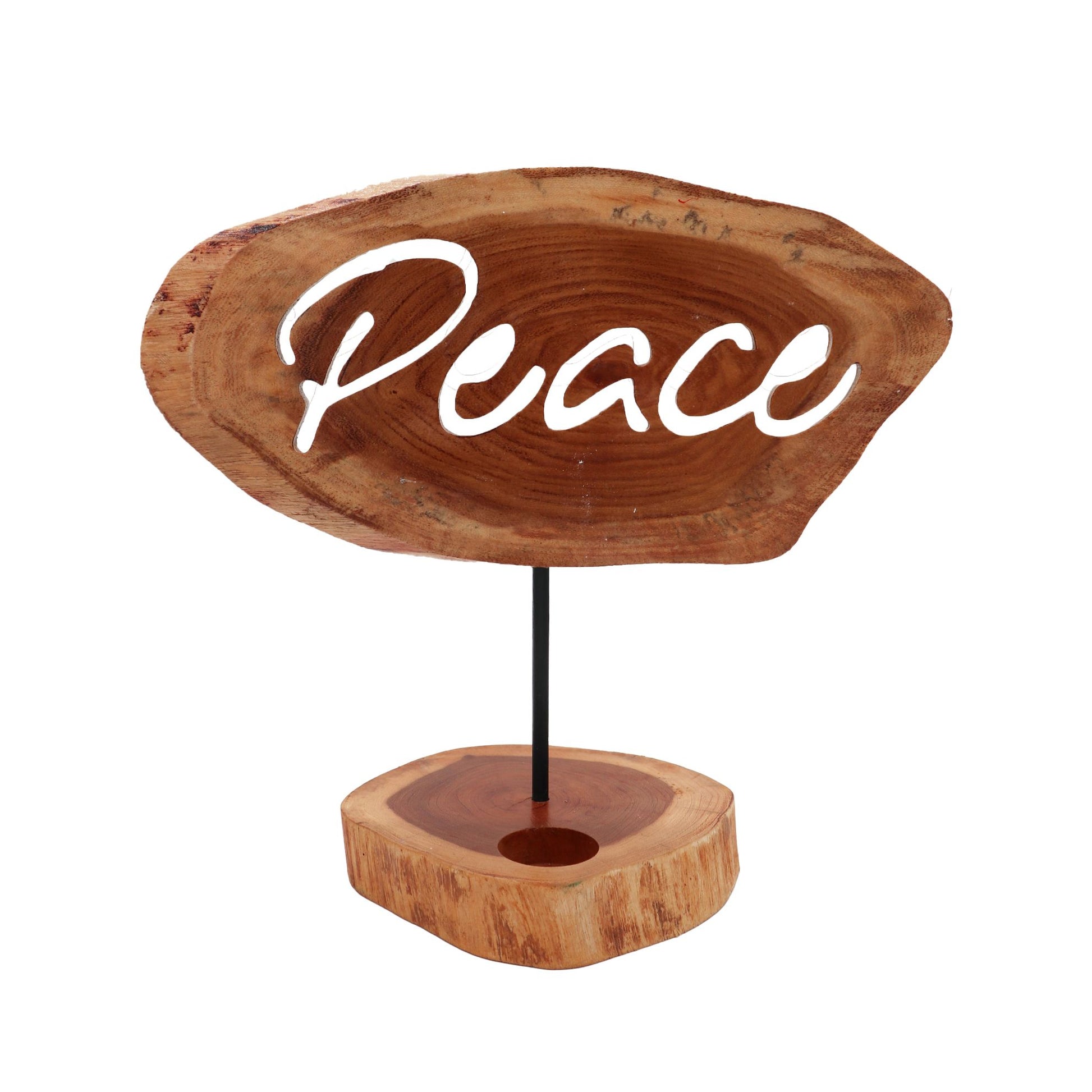 Handmade natural wood candle holder with 'Peace' carved into the front in a simple, rustic design.