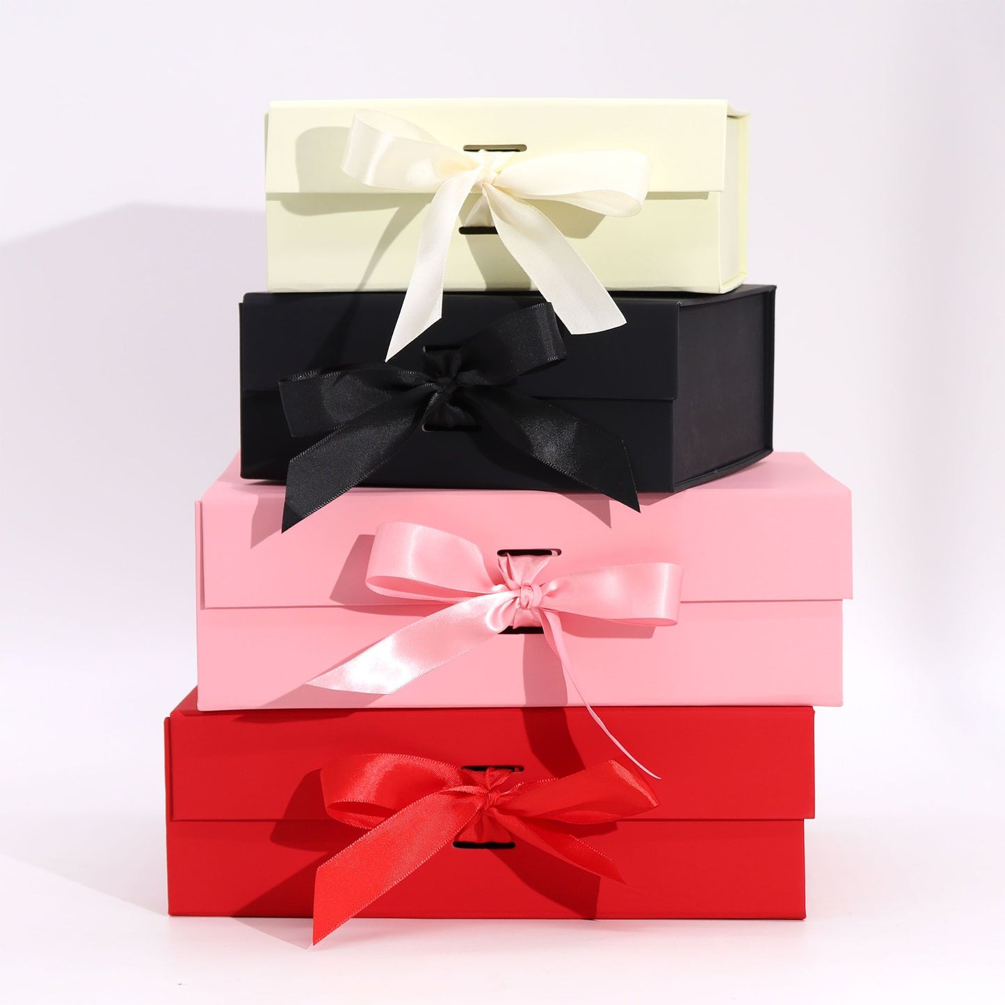 Large rectangular pink cardboard gift box shown flat and assembled for shipping wellness products.