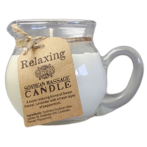 White soy wax massage candle in a ceramic pourer with a single wick for a relaxing aromatherapy massage experience.