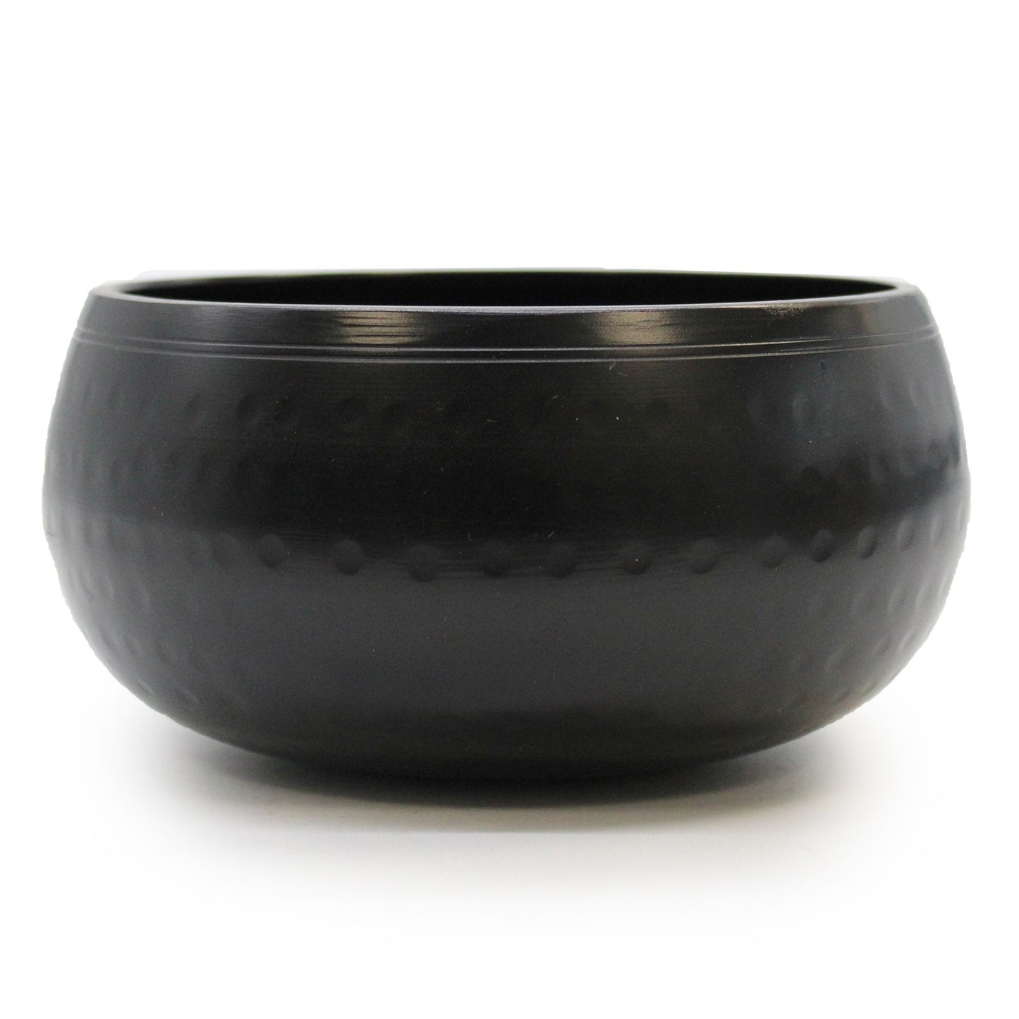 A 15cm medium black beaten metal Tibetan singing bowl with a textured surface and traditional circular base.