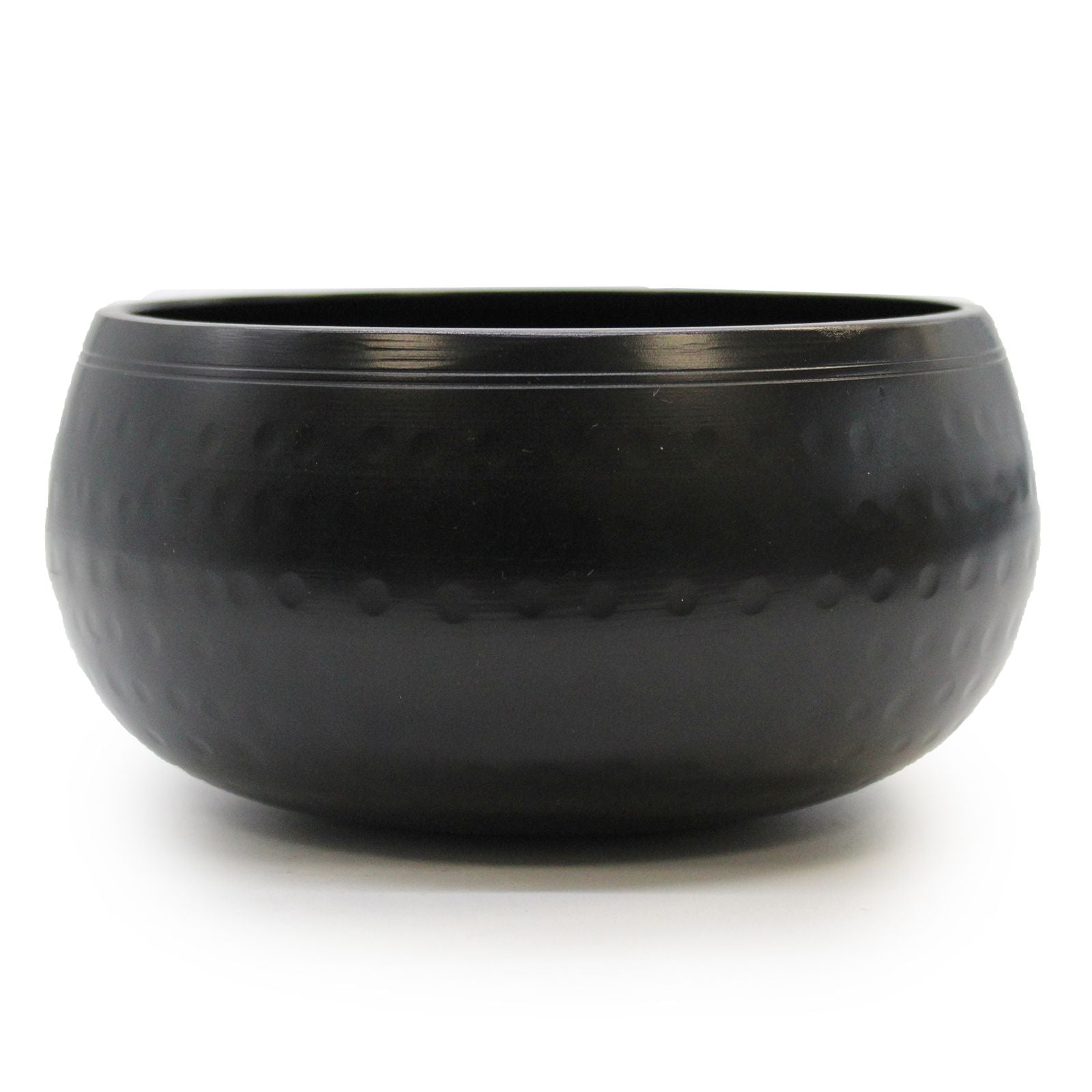 A 15cm medium black beaten metal Tibetan singing bowl with a textured surface and traditional circular base.