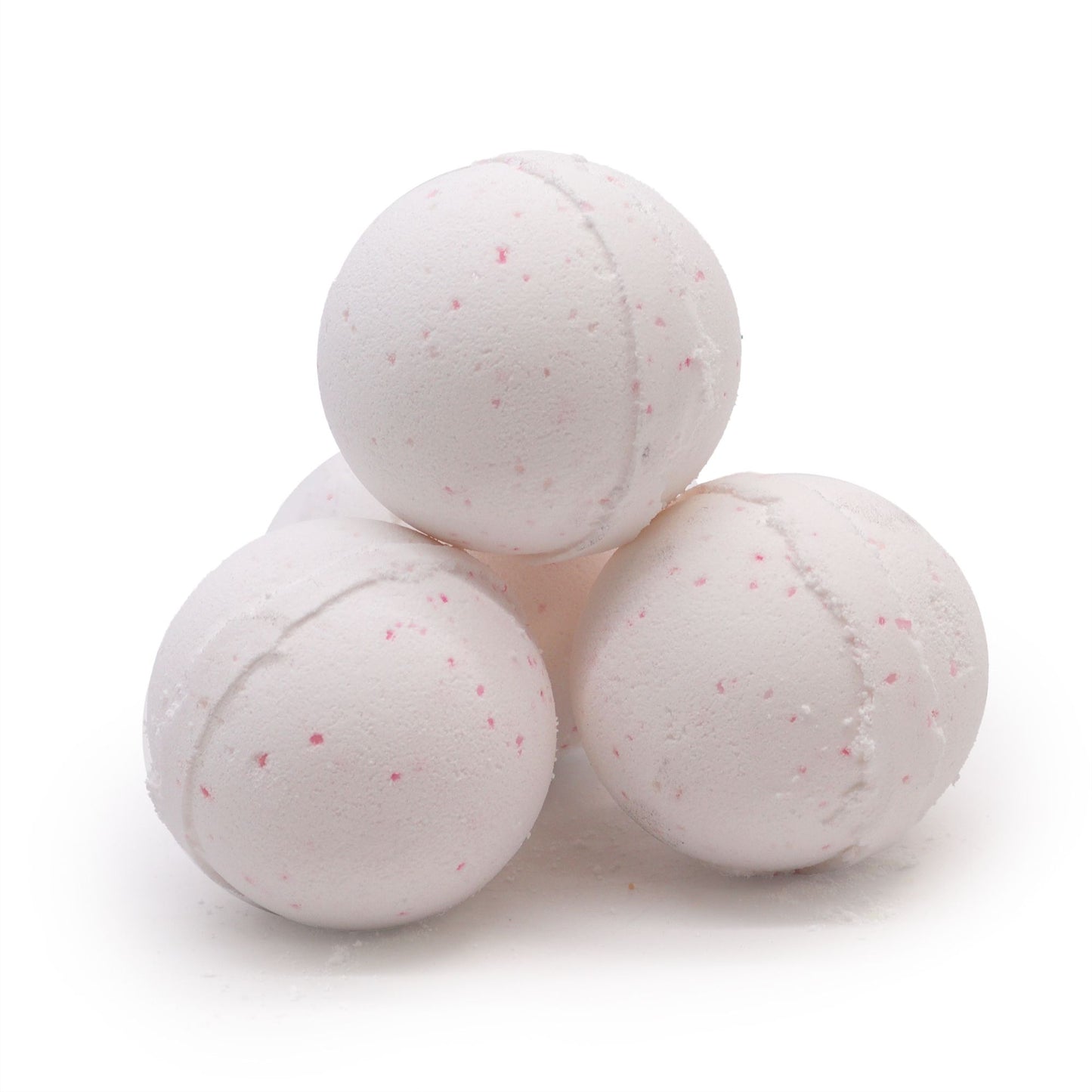 A round, textured bath bomb with orange and yellow hues and dried botanical inclusions.