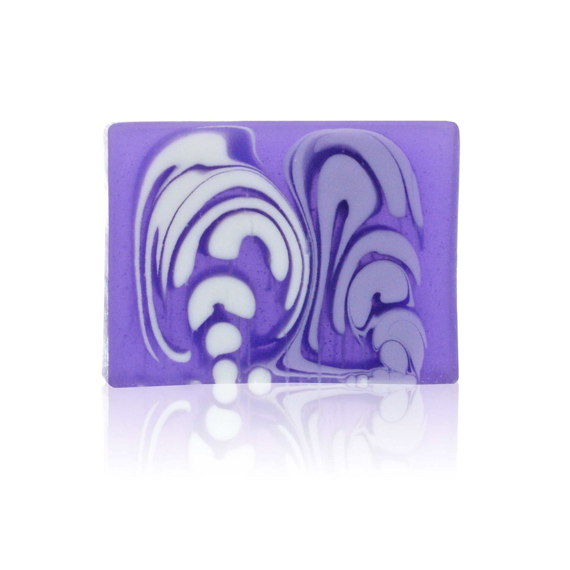 A single slice of handcrafted purple lavender soap showing a natural, textured surface.