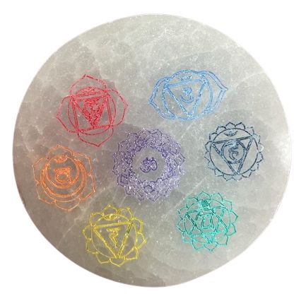 Small round white selenite charging plate featuring a colourful seven chakra symbol design.