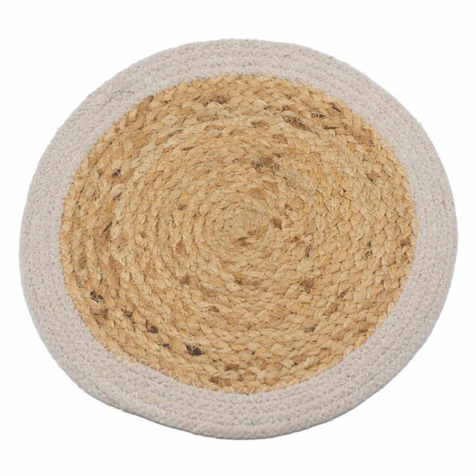Round natural jute and cotton place mat with a contrasting ivory woven border on a wooden table.