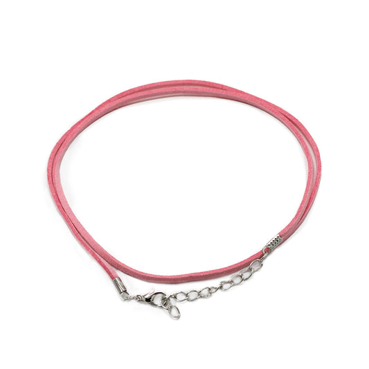 Close-up of a delicate pink faux suede jewellery cord with a silver-coloured clasp and extension chain.