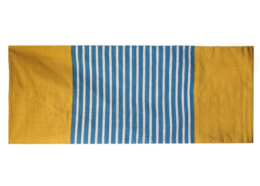 Handcrafted yellow and blue Indian cotton rug with a woven texture, ideal for yoga or home decor.