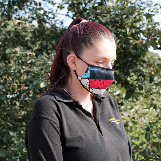 Adult-sized reusable fabric face covering featuring a vibrant and colorful urban graffiti art design.