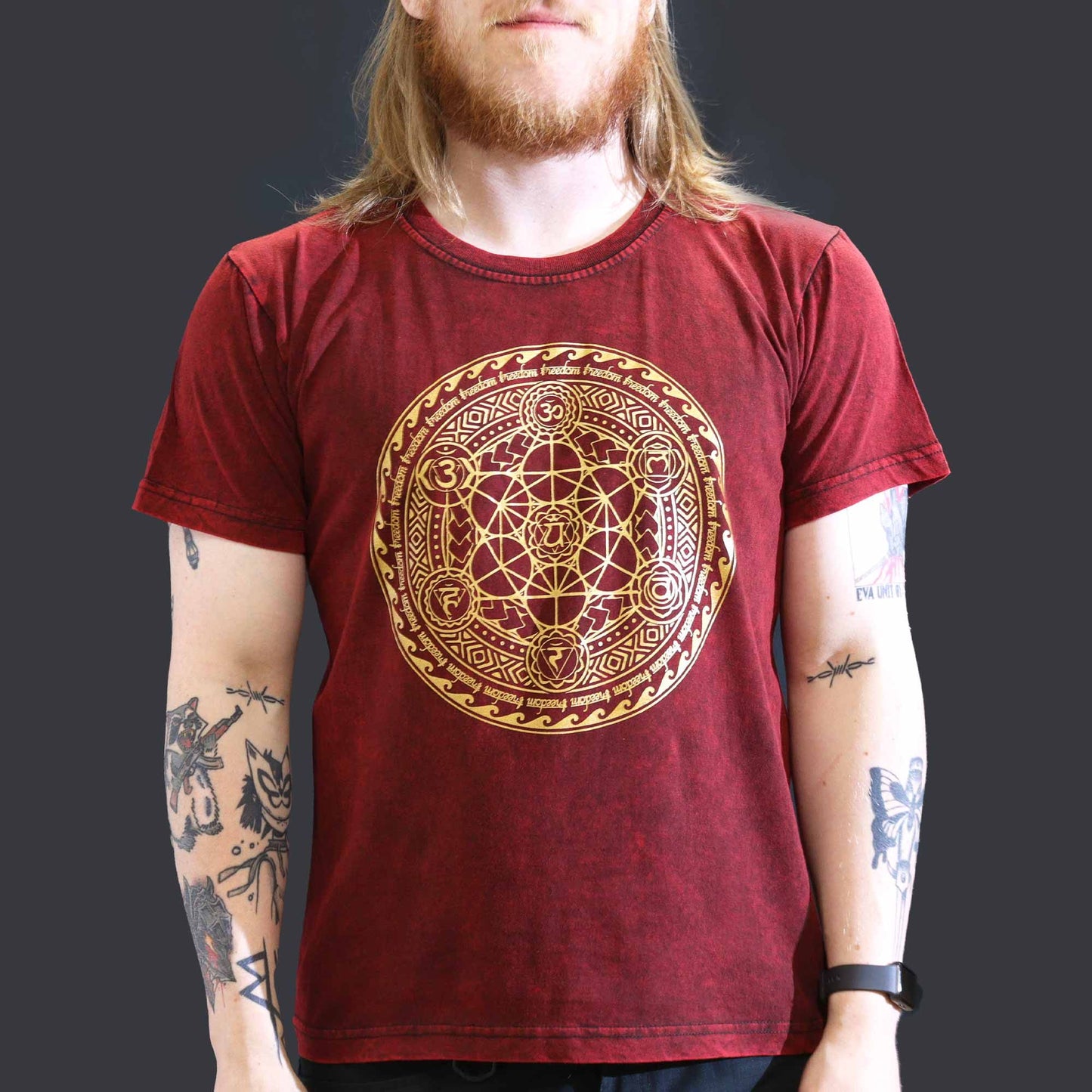 Large maroon stonewashed t-shirt featuring a vertical chakra symbol design on the front.