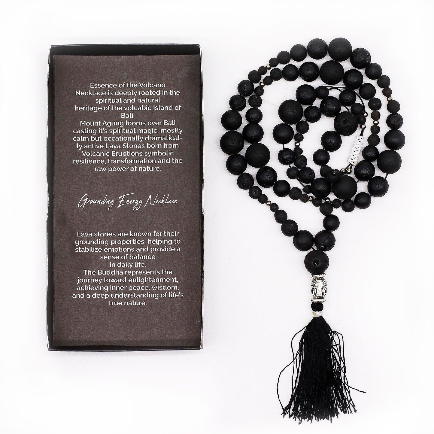 Handmade lava stone necklace featuring dark textured beads, a small silver Buddha charm, and a soft decorative tassel.