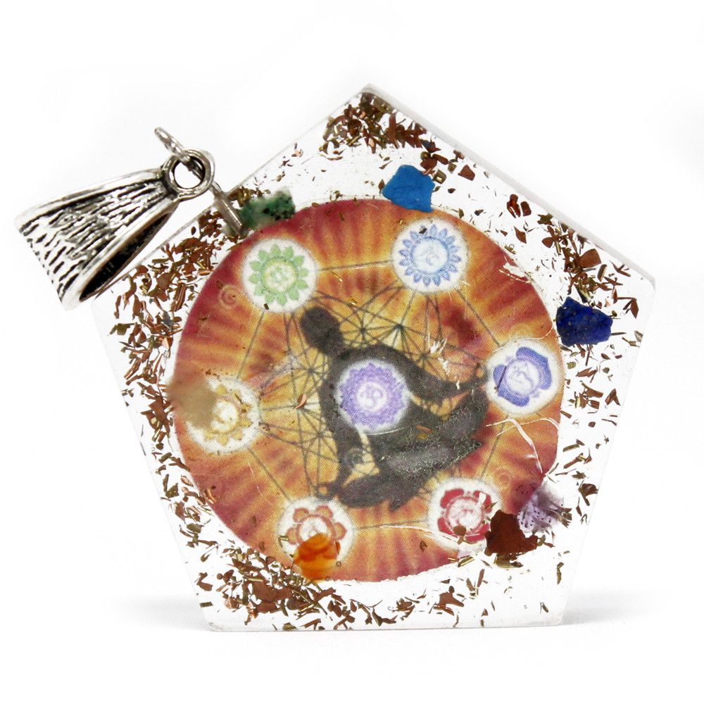 Pentagon shaped orgonite pendant featuring colourful chakra gemstone chips, copper coils, and metal filings in clear resin.