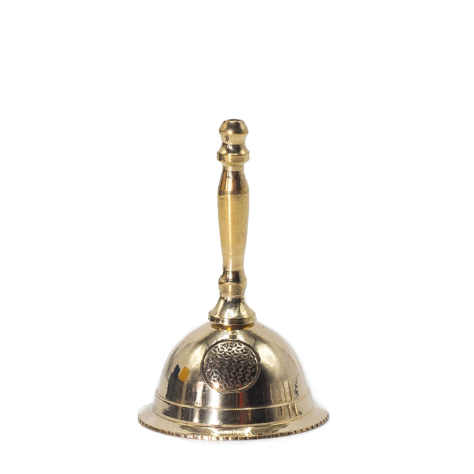 Small polished brass altar bell featuring an engraved Flower of Life symbol on the side.