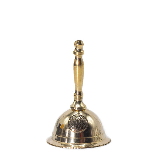 Small polished brass altar bell featuring an engraved Flower of Life symbol on the side.