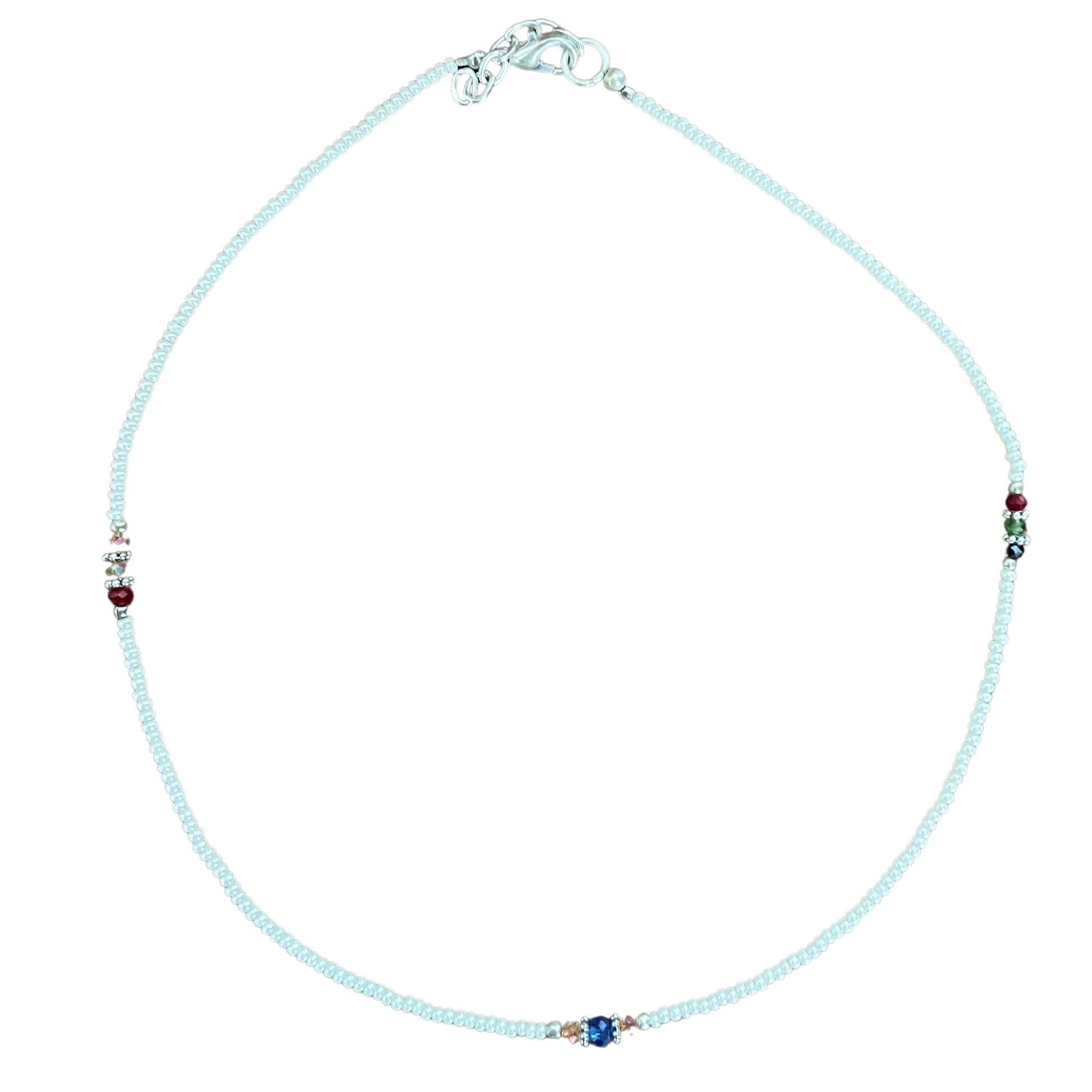 Exquisite handmade necklace featuring luminous white pearls and intricately faceted clear beads.