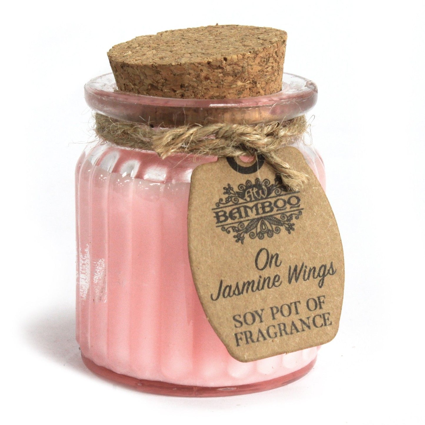 Small round jar of white soy wax candle with a floral label and a natural cotton wick.