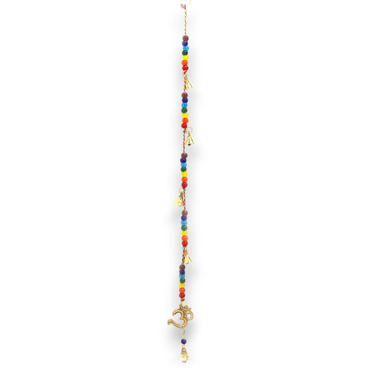 Brass OM symbol hanging chime with colourful chakra beads and small bells on a decorative string.