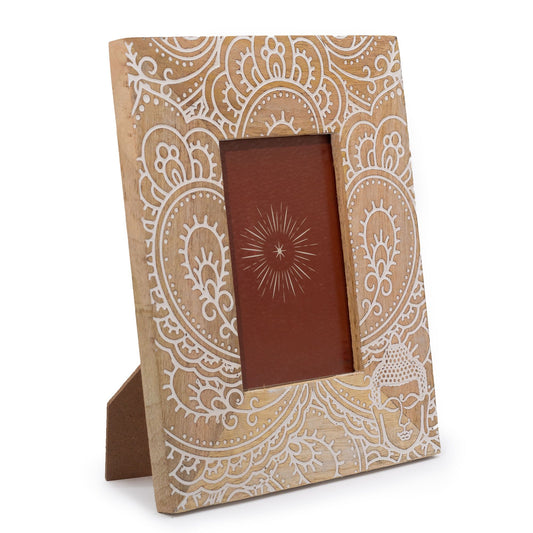 Hand-carved white mango wood picture frame featuring a serene Buddha design, suitable for 10x15cm photos.