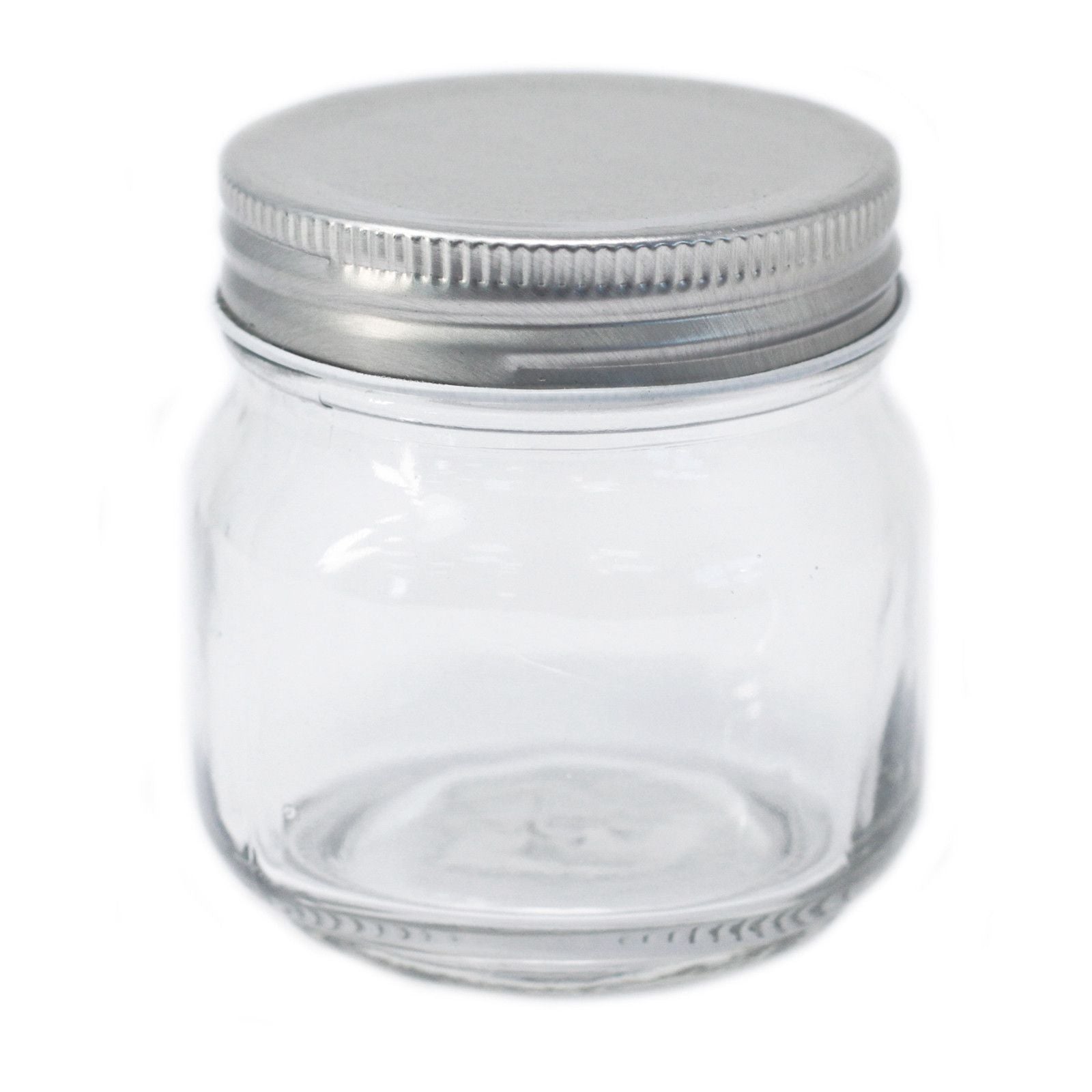 Clear square glass jar with four flat sides and a silver twist-off metal lid on a plain background.