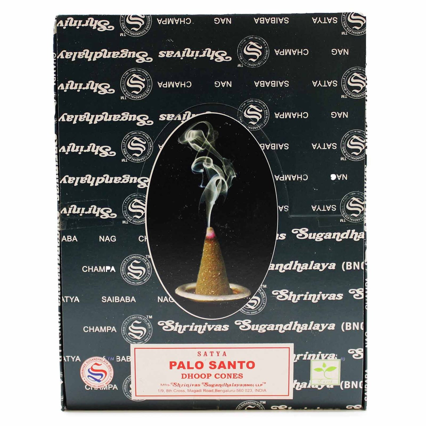 Small dark brown conical dhoop incense cones made from palo santo wood on a simple heatproof ceramic dish.