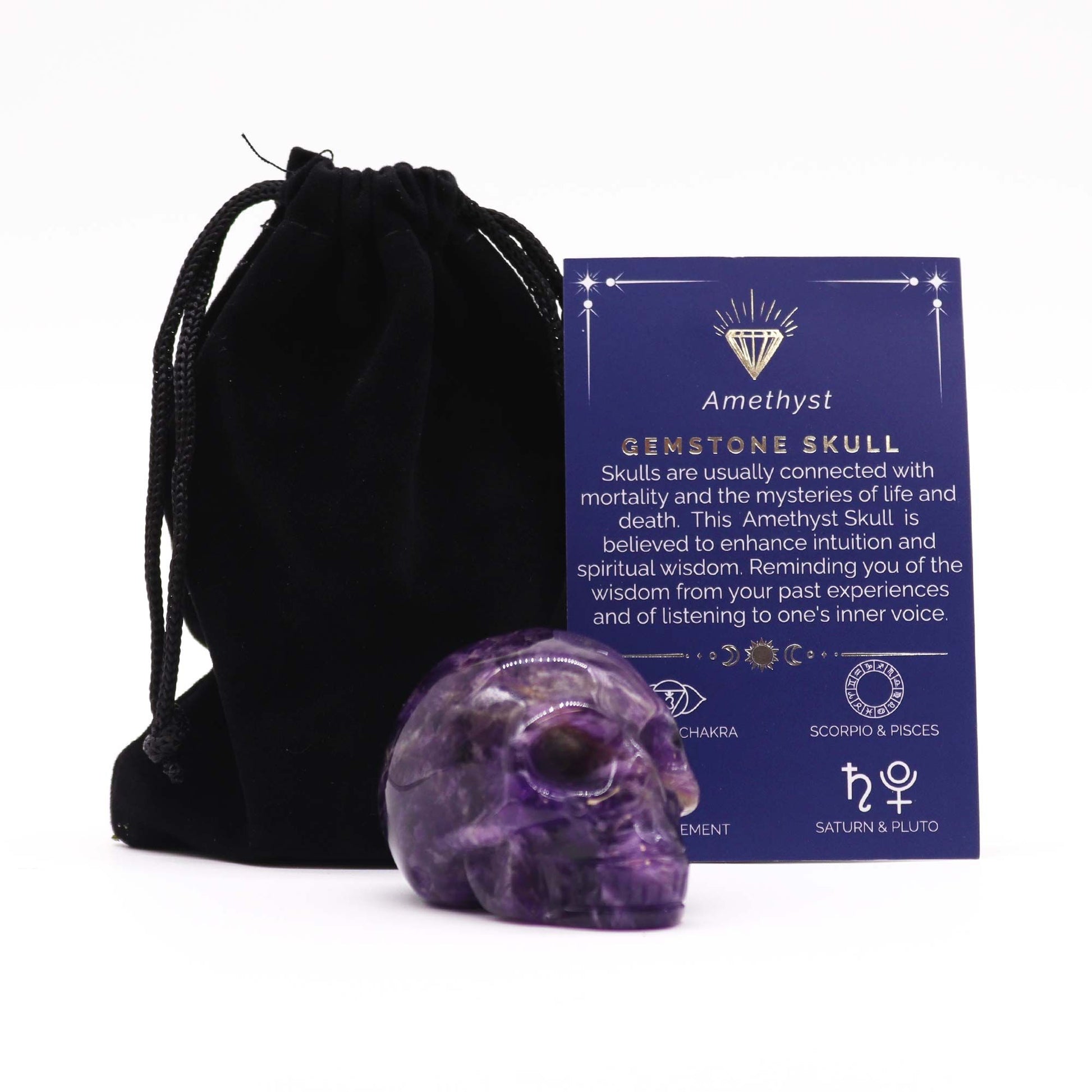 Detailed hand-carved purple amethyst gemstone skull with natural crystalline inclusions and a polished finish.