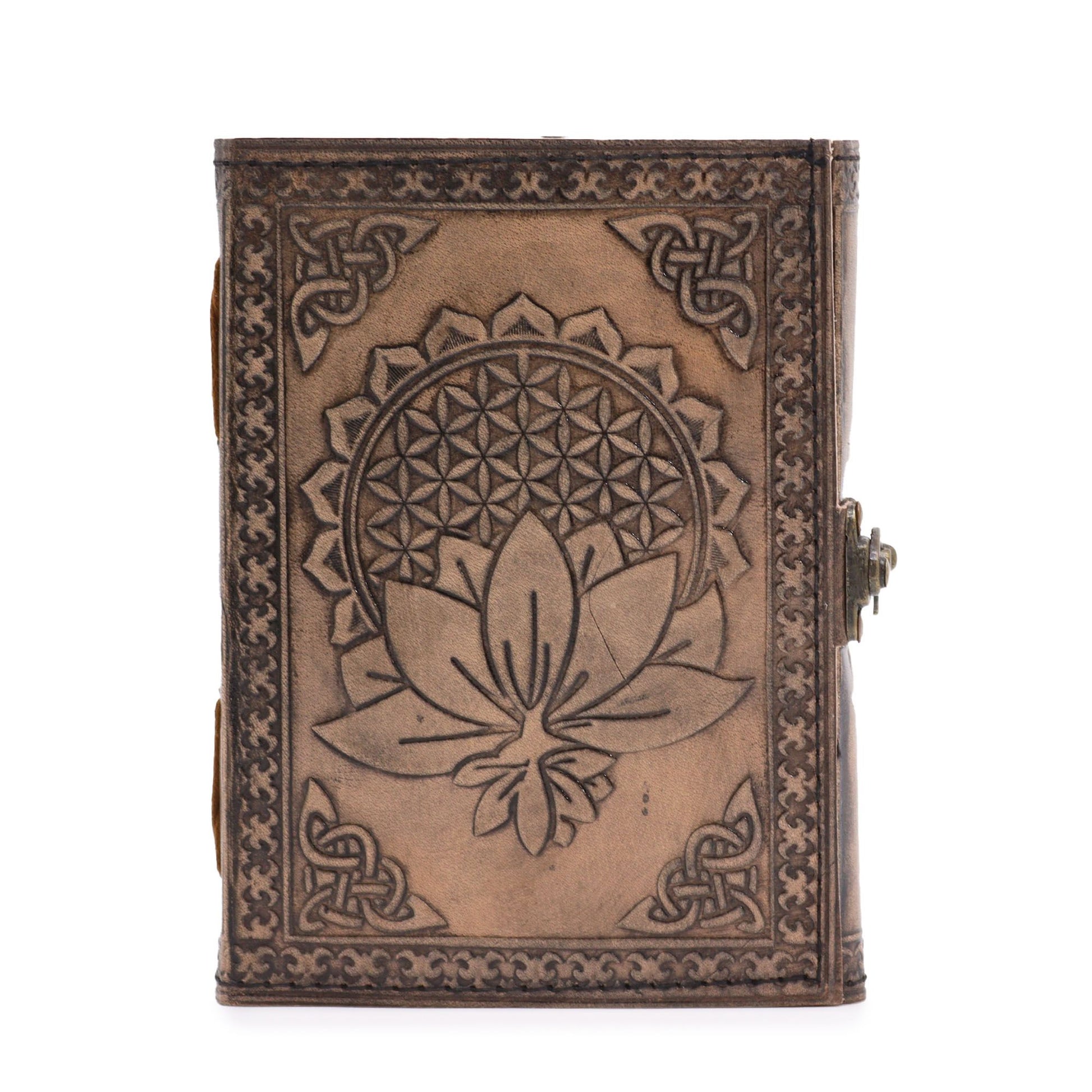 Antique grey leather notebook featuring an embossed lotus mandala design with hand-stitched edges on a wooden surface.