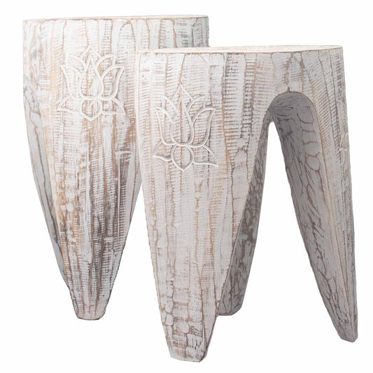 Pair of cylindrical wooden stools with an interlocking carved design and a light whitewash finish.