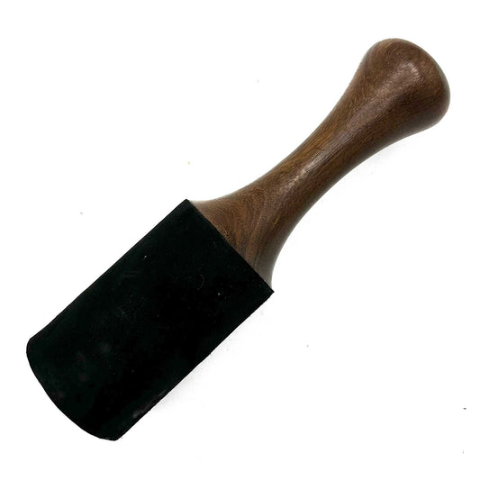Large smooth wooden singing bowl striker with a thick cylindrical design and rounded ends for sound healing.