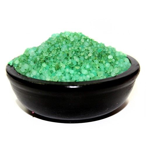 Blue aromatic simmering granules for home fragrance in a simple clear pile.
