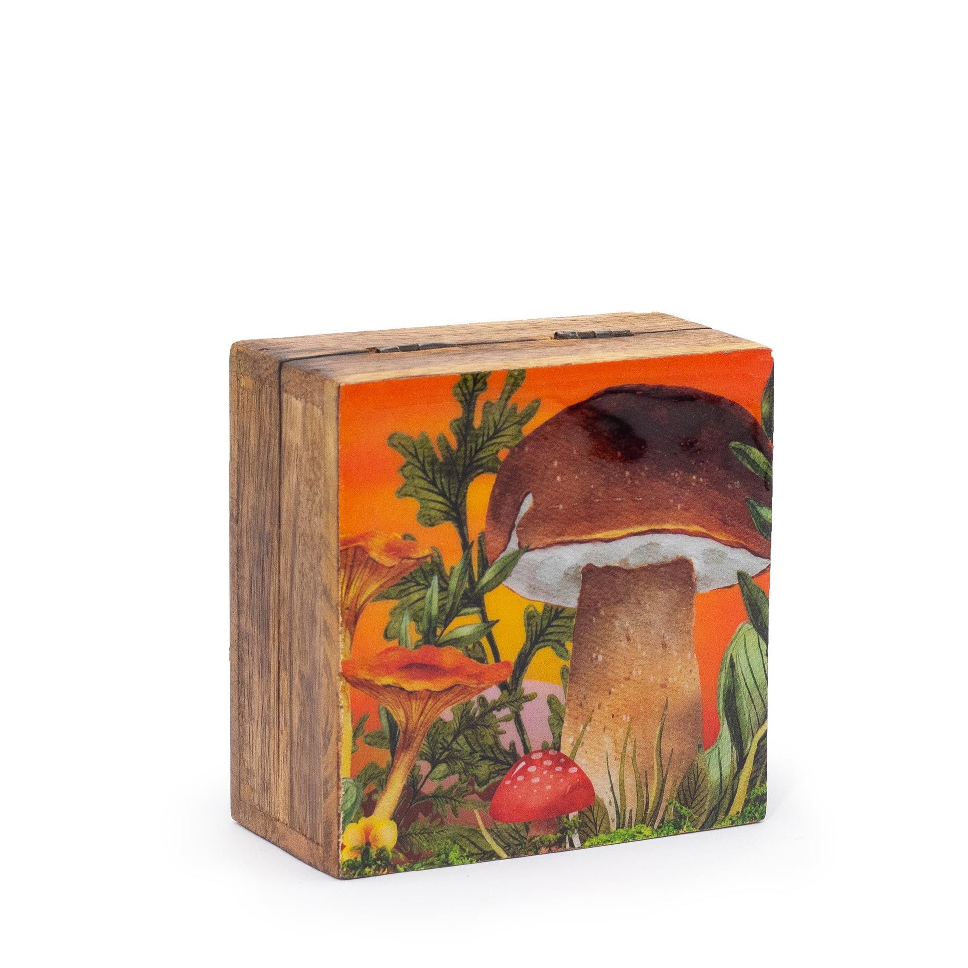 Small square maroon enameled trinket box with a white and red mushroom design on the lid.