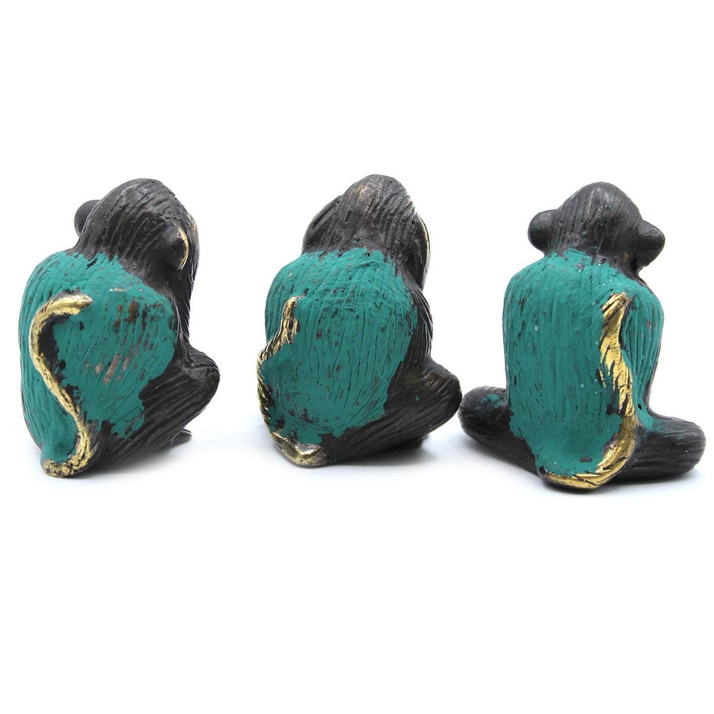 Set of three small polished brass monkey figurines depicting see no evil, hear no evil, and speak no evil gestures.