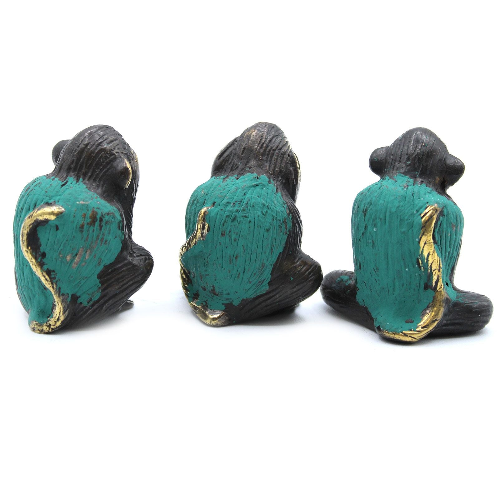 Set of three small polished brass monkey figurines depicting see no evil, hear no evil, and speak no evil gestures.