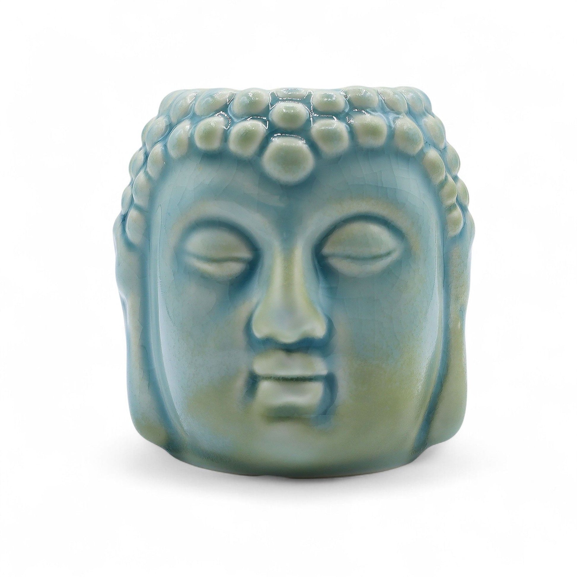 Serene blue ceramic Buddha head oil burner with a decorative glazed finish and tea light candle slot.