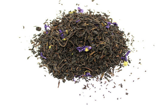 Large 1kg bag of premium loose leaf black tea with vibrant purple mauve petals and traditional bergamot fragrance.