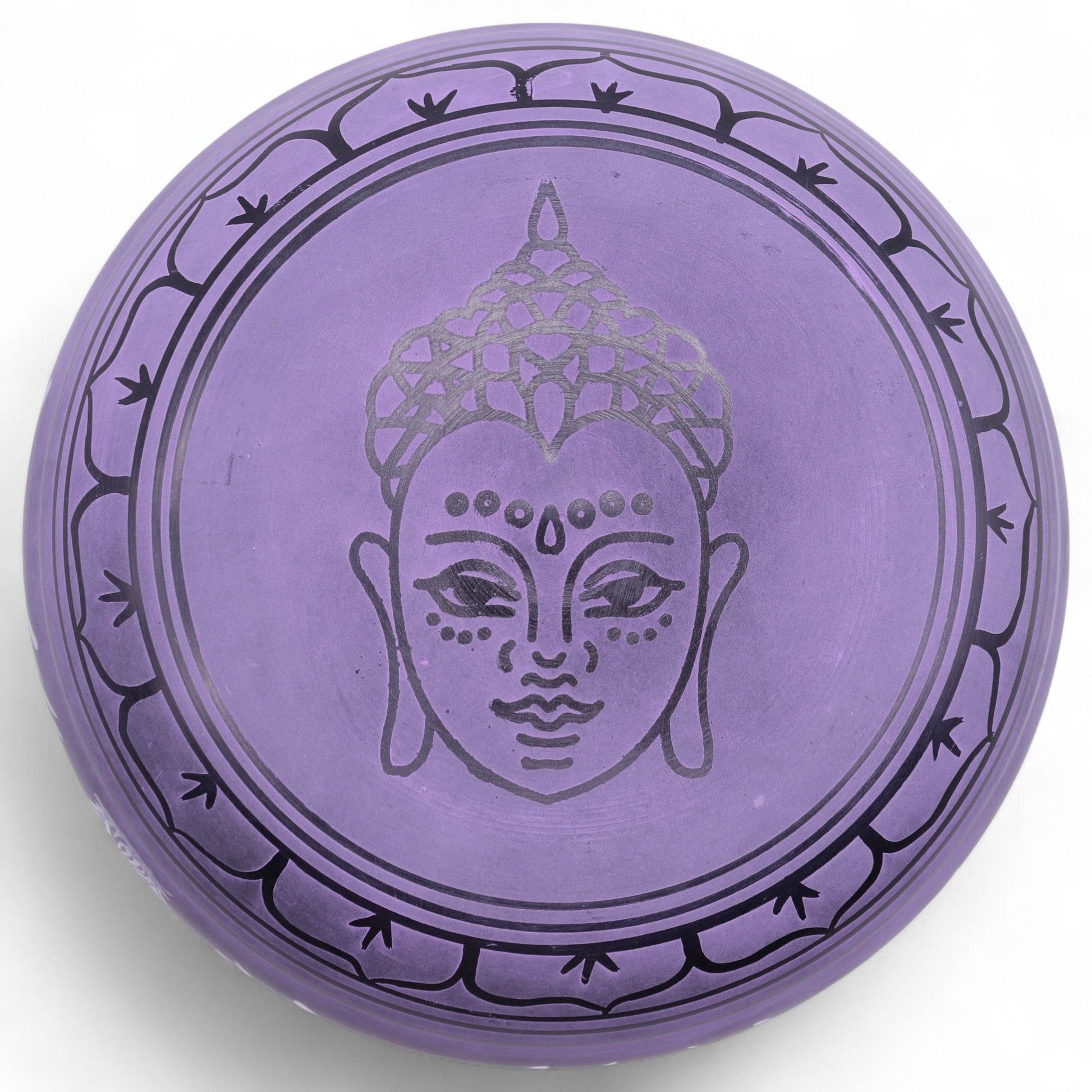 Striking purple brass mushroom-shaped singing bowl for meditation and sound therapy.