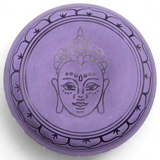 Striking purple brass mushroom-shaped singing bowl for meditation and sound therapy.