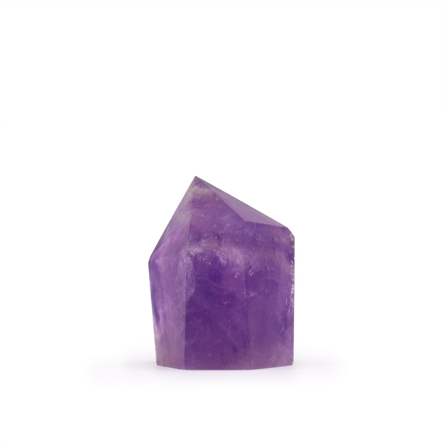 A small, vibrant purple amethyst crystal point with natural facets and a sharp termination.