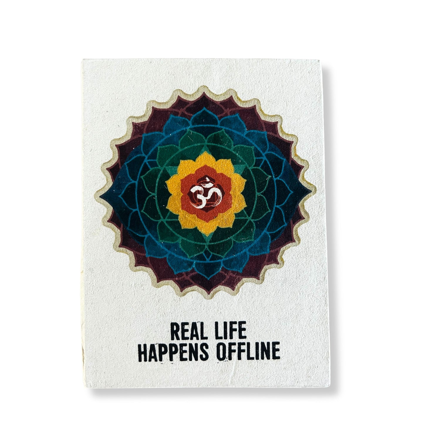 Large handmade Lokta paper notebook with a vibrant mandala design and the text Real Life Happens Offline.