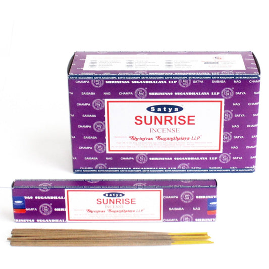 Hand-rolled incense sticks in a yellow and blue sunrise themed rectangular box.