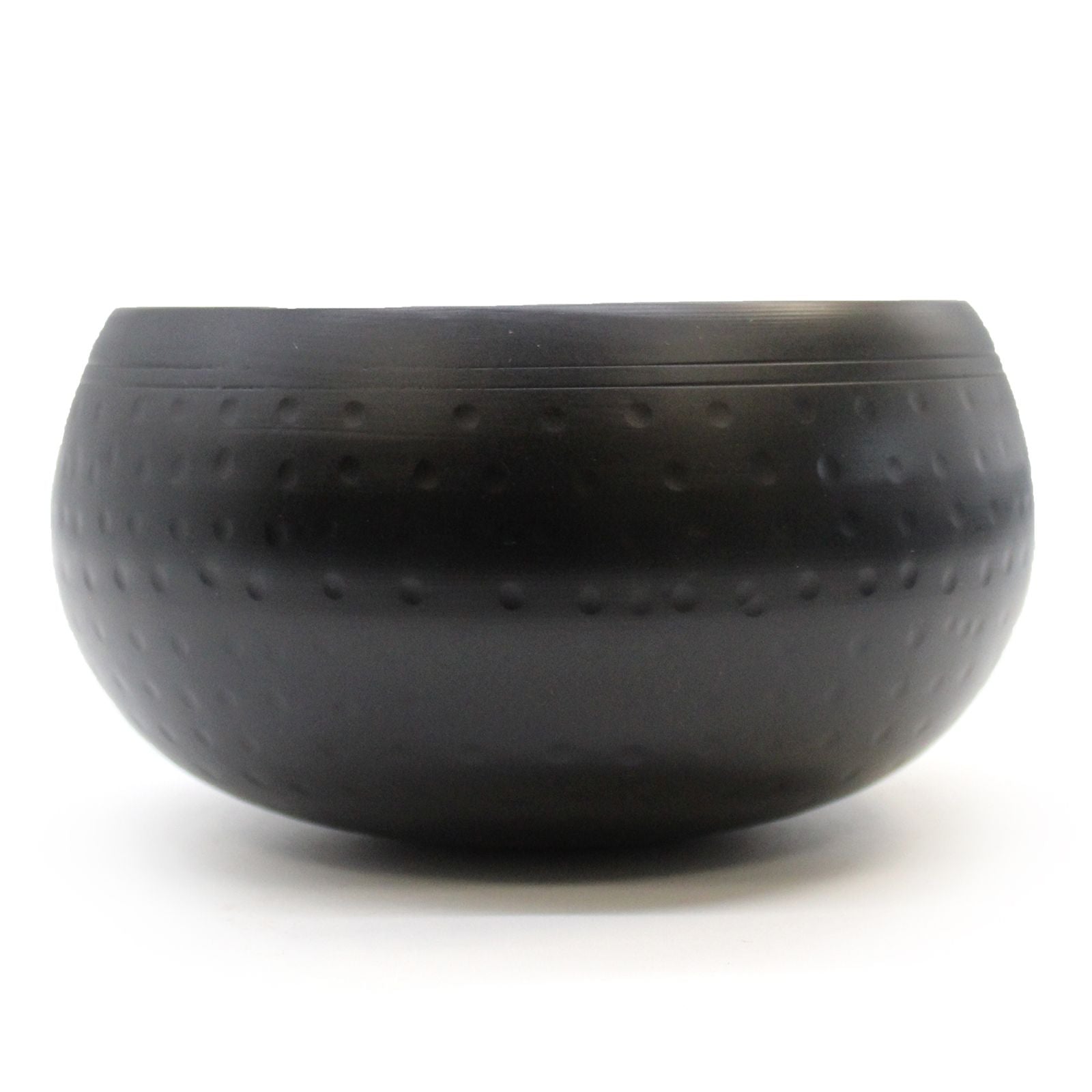 Large hand-beaten black Tibetan singing bowl with a textured matte finish and traditional rounded shape.