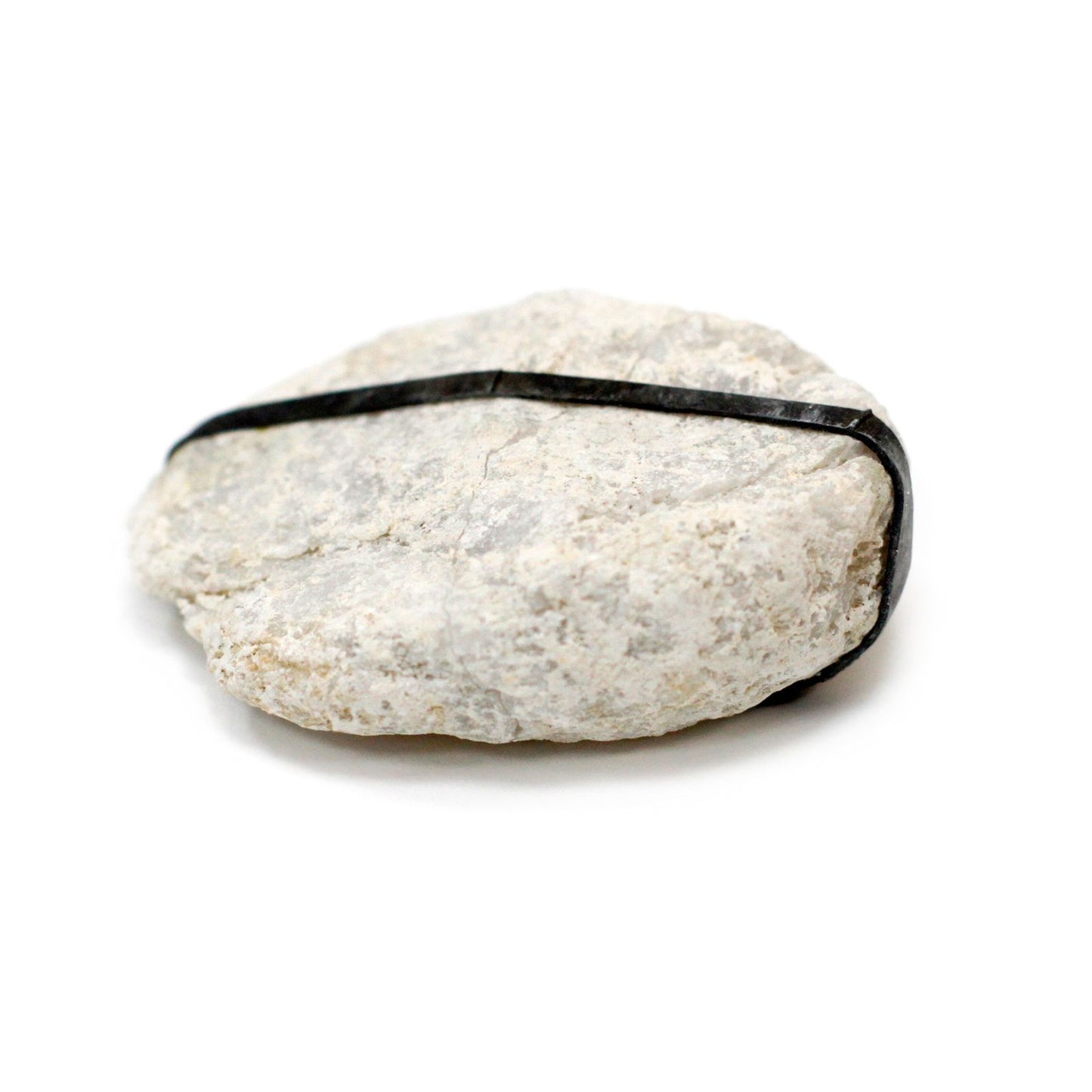 Two small natural calcite geode halves showing sparkling white crystalline interiors on a neutral background.