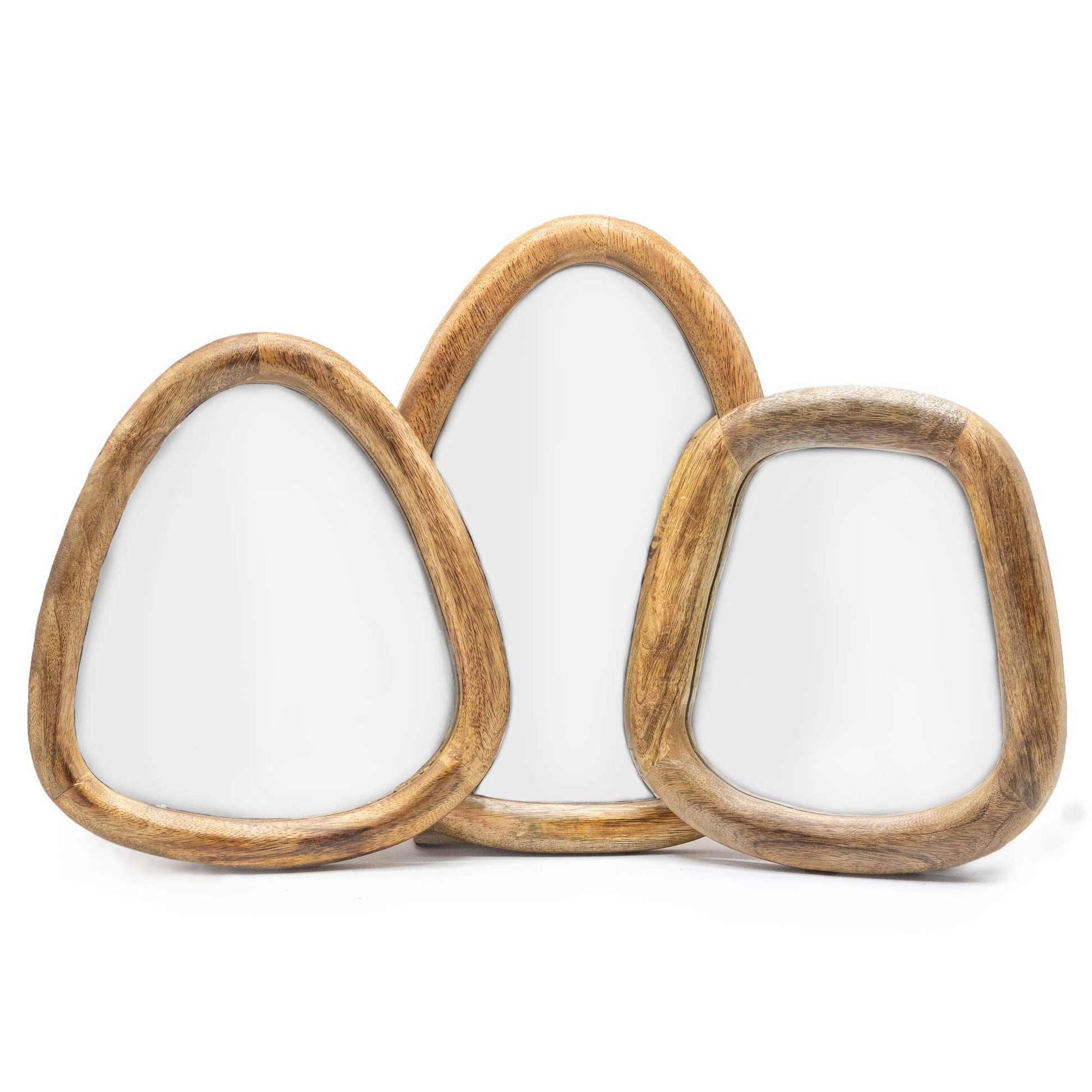 Three organic pebble shaped mirrors with dark brown wooden frames arranged on a plain wall.